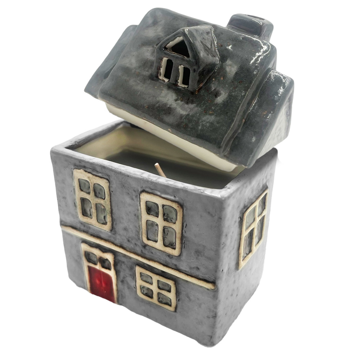 Fresh Linen house candle with removable ceramic roof revealing wax interior and wick.