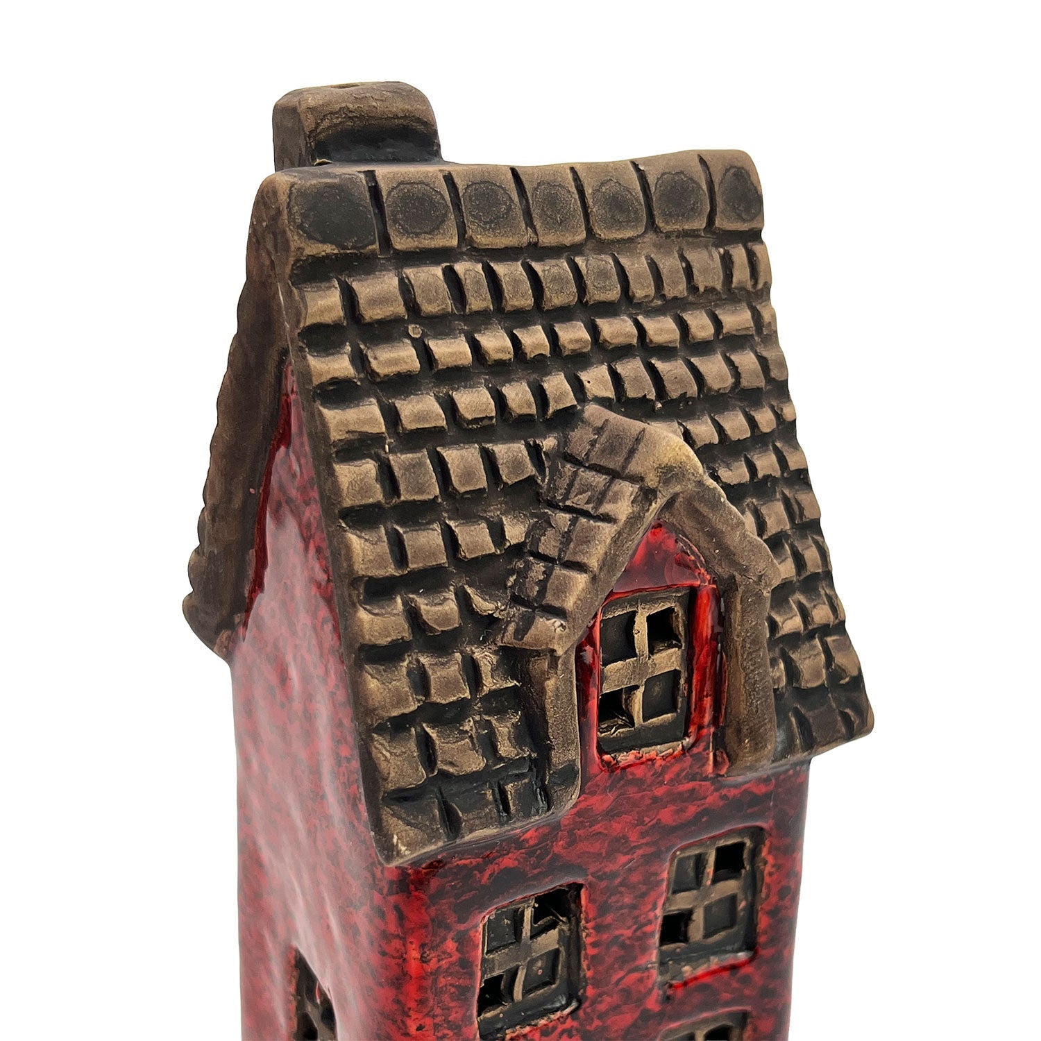 Close-up of the roof on the Scribe’s Retreat LED house displaying hand-carved tiles and detailed ceramic craftsmanship.