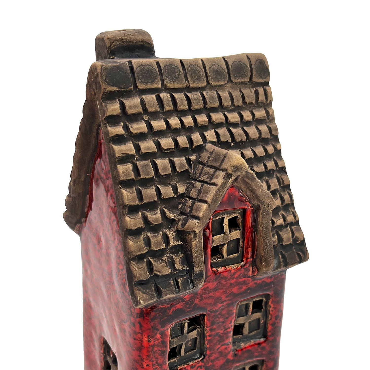 Close-up of the Goldsmith’s Abode ceramic house roof showing textured tiles and fine hand-painted craftsmanship.