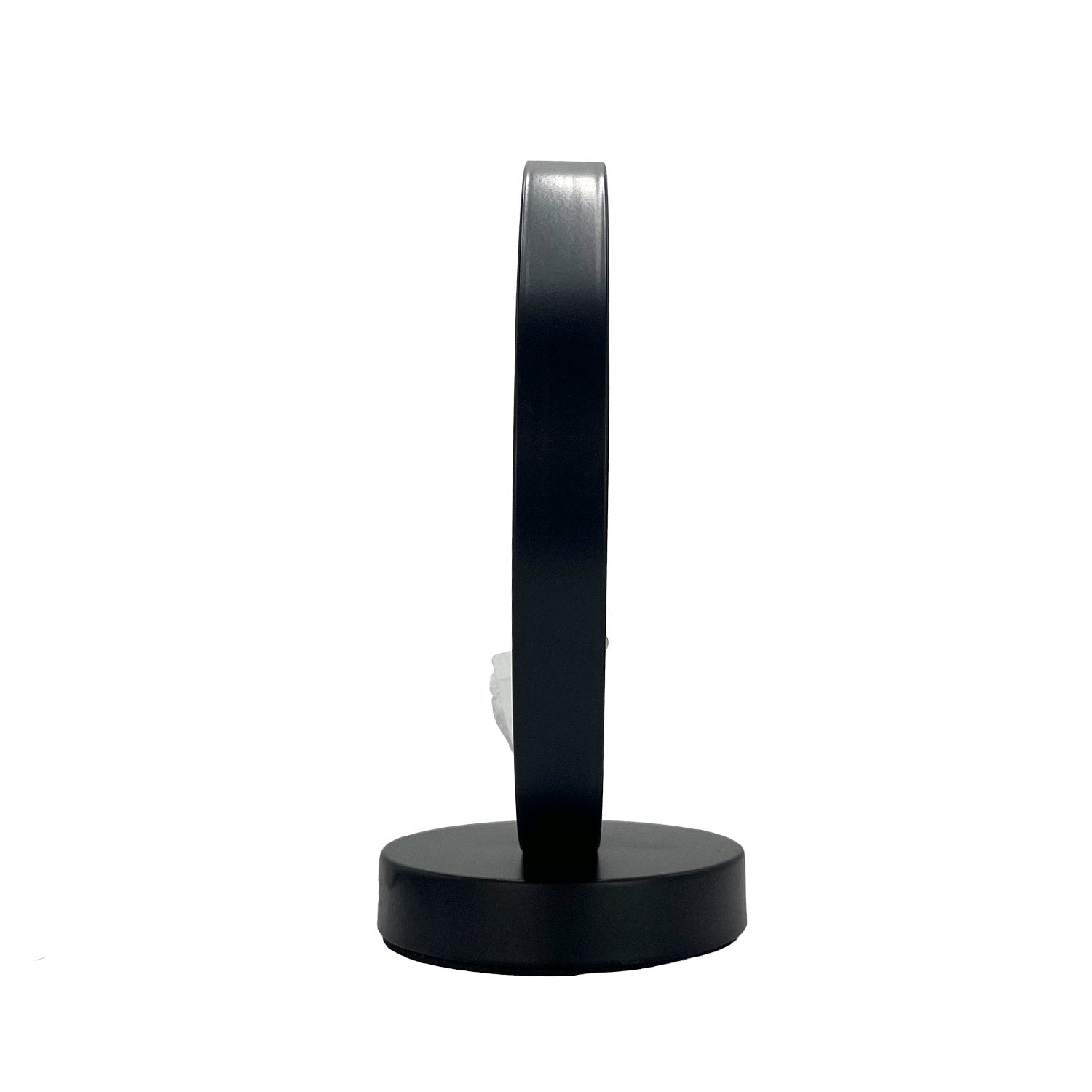 Side view of the Gleneagles Circle Earth  Mixed Mineral Lamp, displaying the sleek circular frame and gentle LED glow illuminating the crystal.