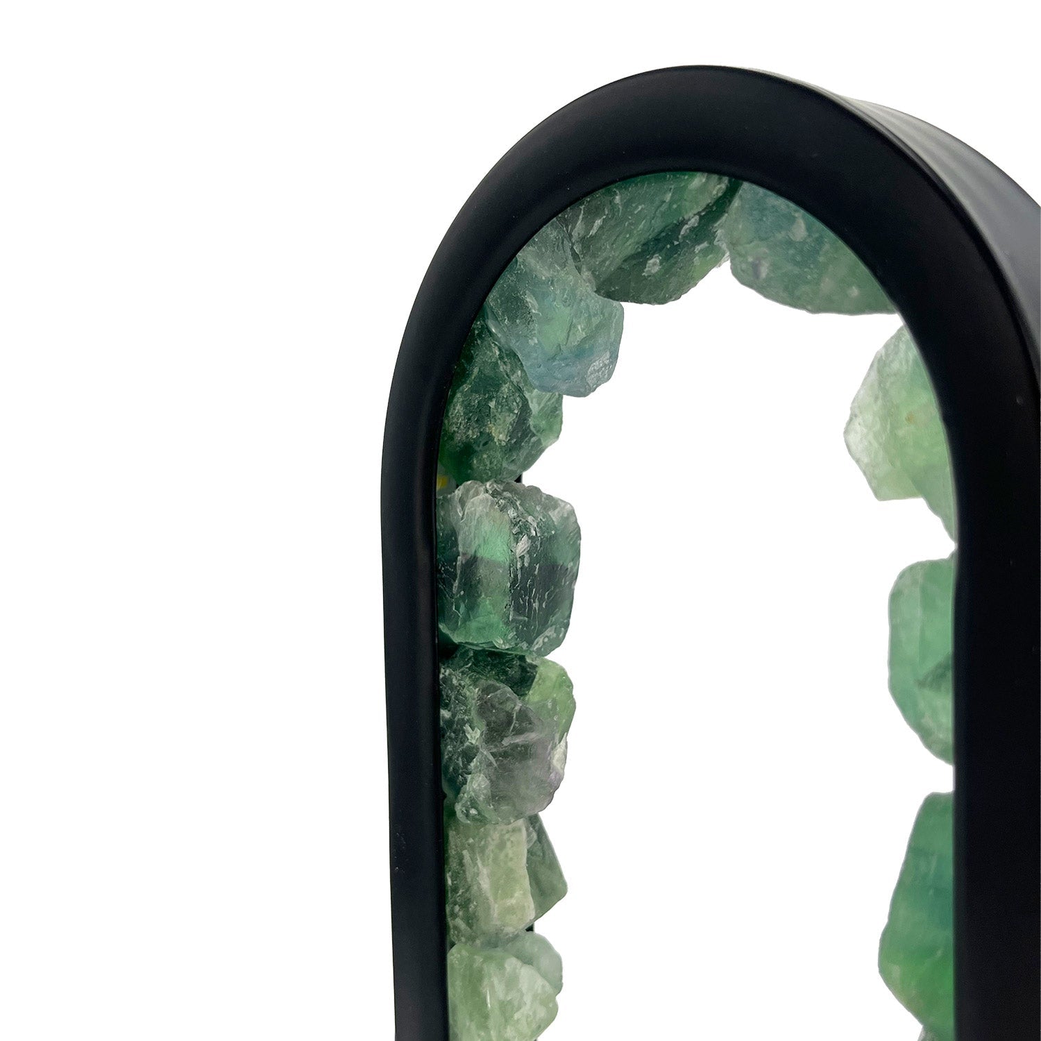 Close-up of Gleneagles Oval Earth LED Lamp highlighting the natural green fluorite crystal texture illuminated with warm ambient light.