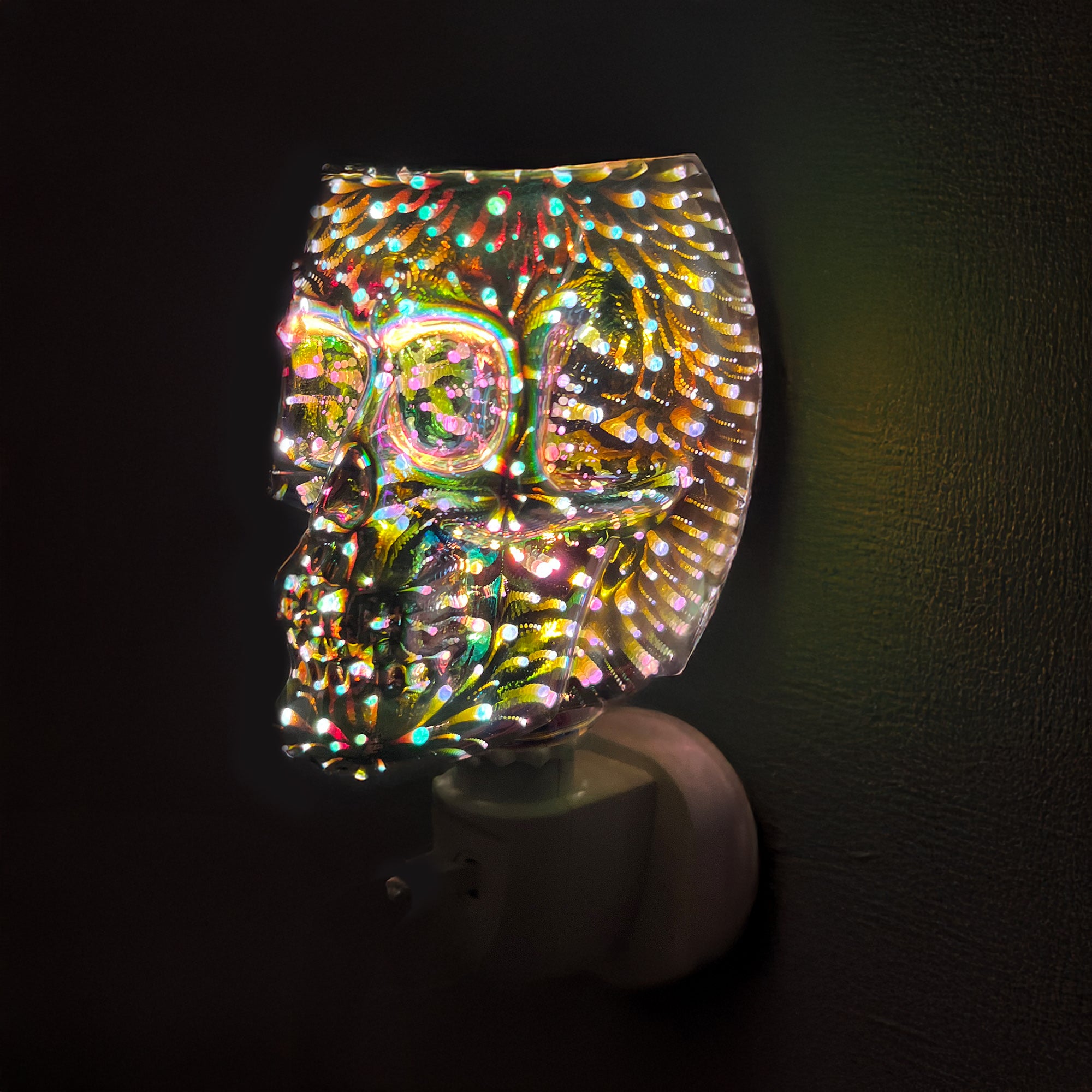 Infinity Skull Plug In Electric Wax Melt Burner glowing in a modern home setting, adding gothic style and relaxing fragrance to the room.