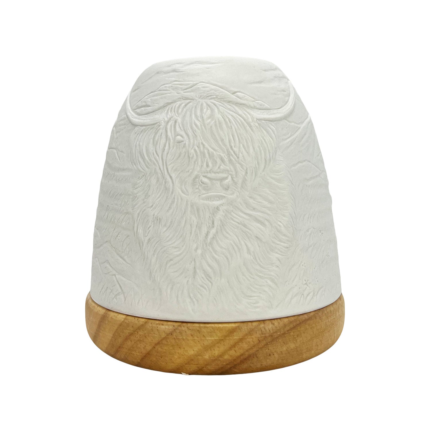 Unlit porcelain Highland Cow tealight dome showing embossed lithophane pattern