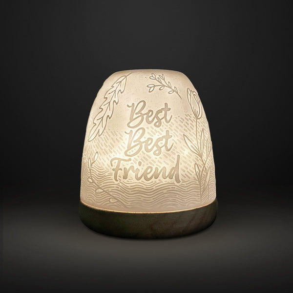 Cello tall tealight dome Best Best Friend design glowing on dark background